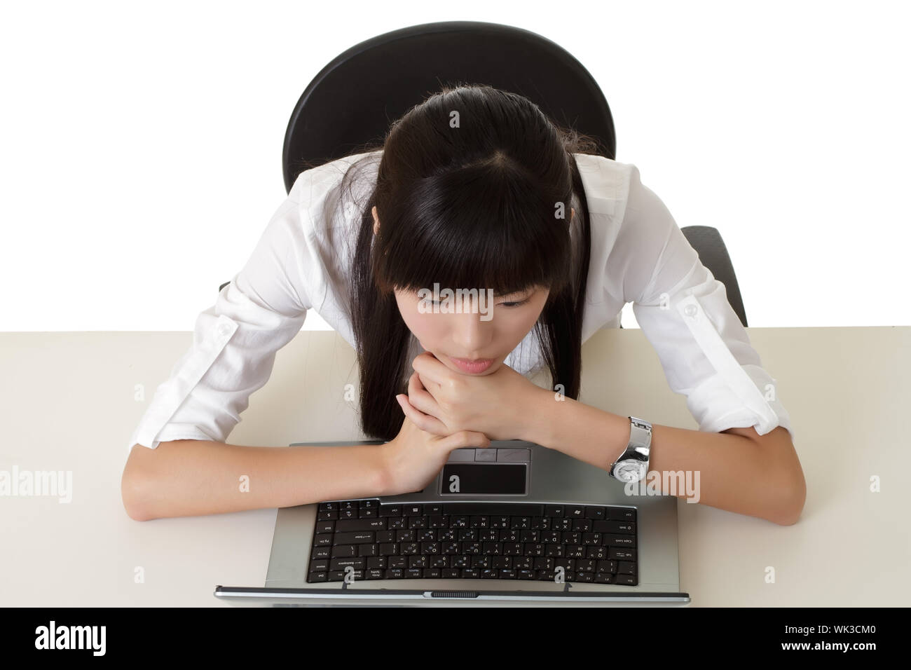 Boring business woman working and looking screen in laptop. Stock Photo