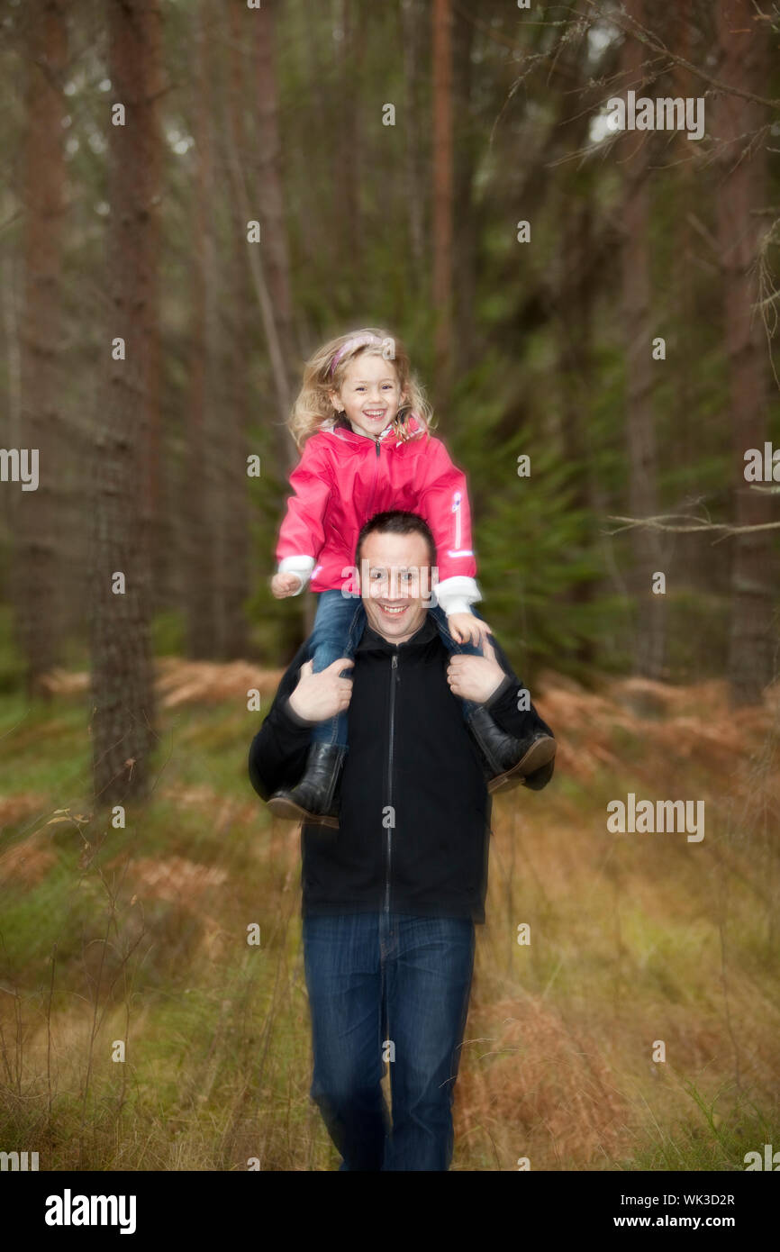 Father and his daughter in the forest Stock Photo - Alamy