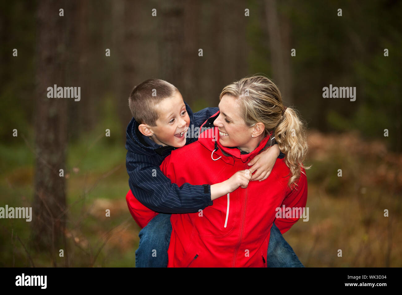 Mother and her son in the forest Stock Photo Alamy