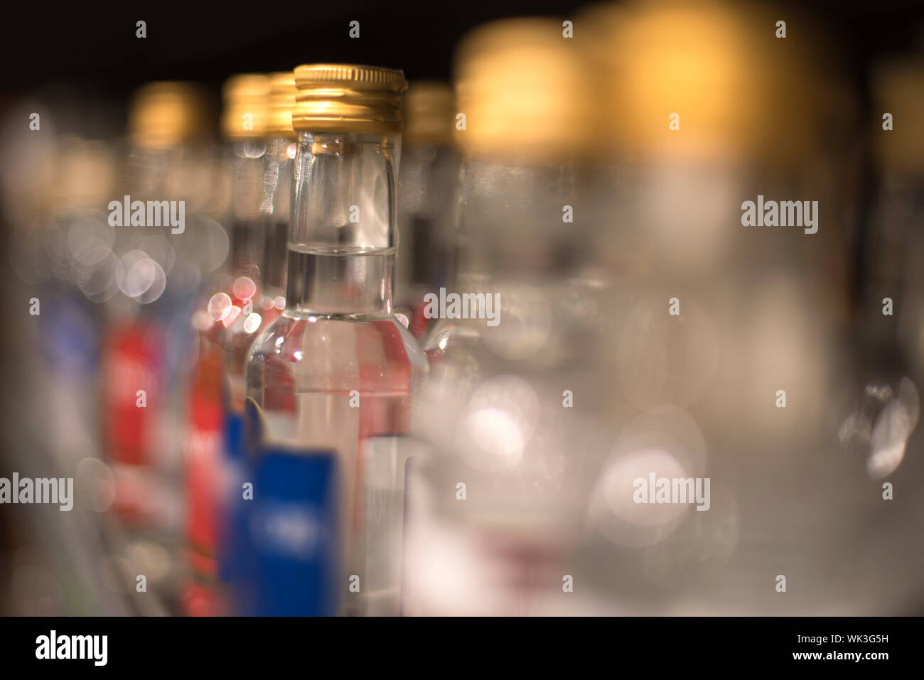Bottles of vodka stand in a row in the store Stock Photo Alamy