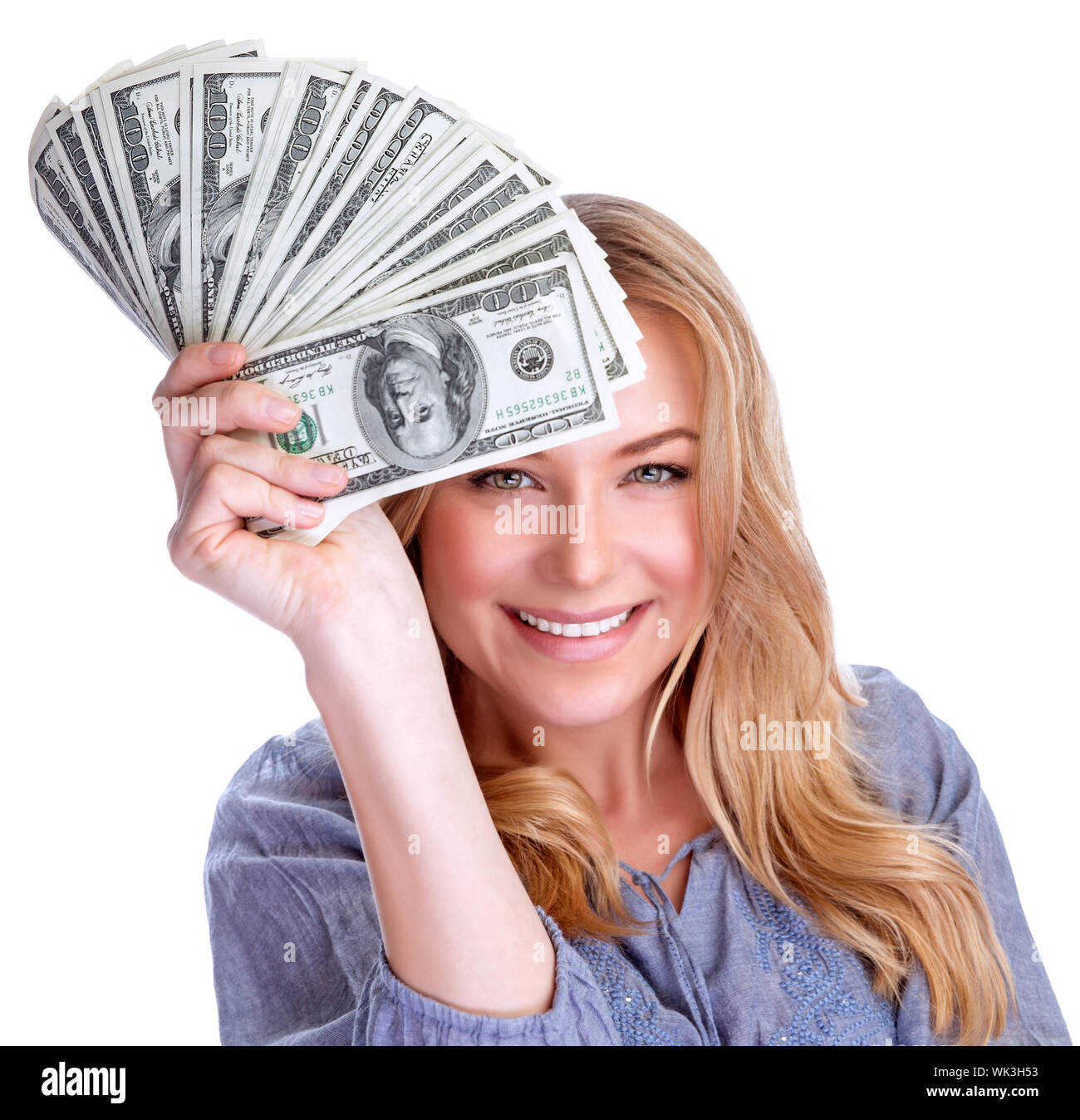 Portrait of attractive cheerful female showing many banknotes of one ...