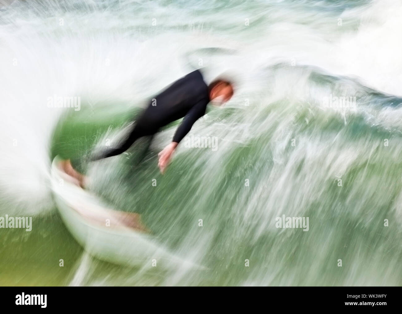 Motion blur surfer surfing wave hi-res stock photography and images - Alamy