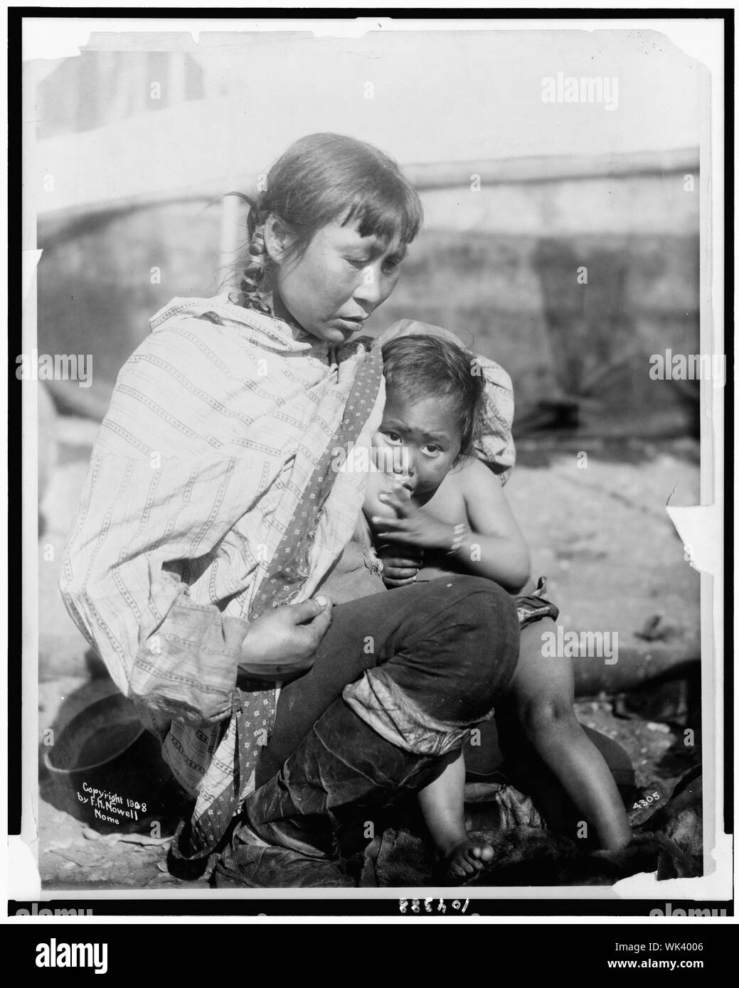 Inuit Eskimo woman breastfeeding baby Stock Photo Alamy