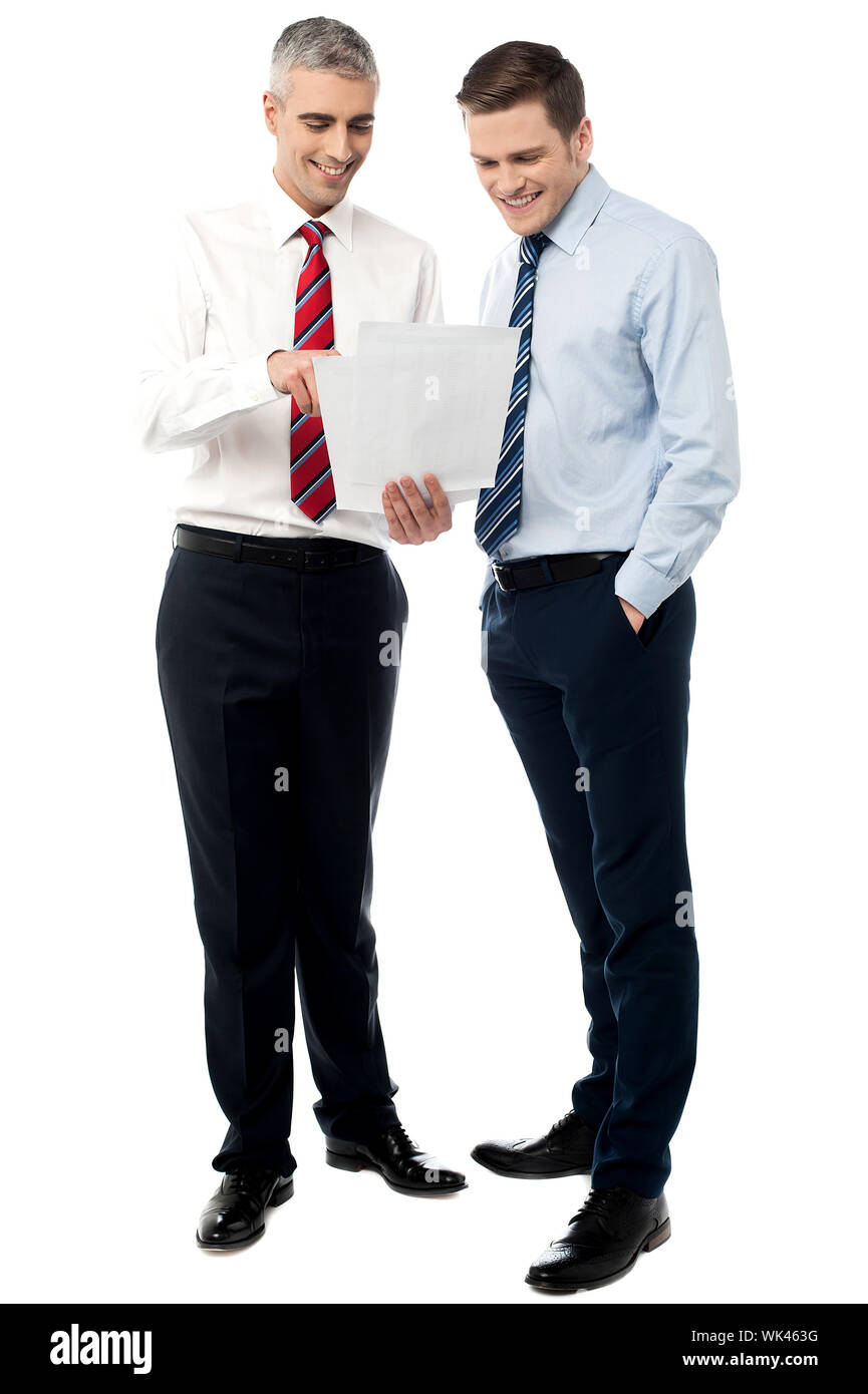 Business colleagues discussing a project reports Stock Photo