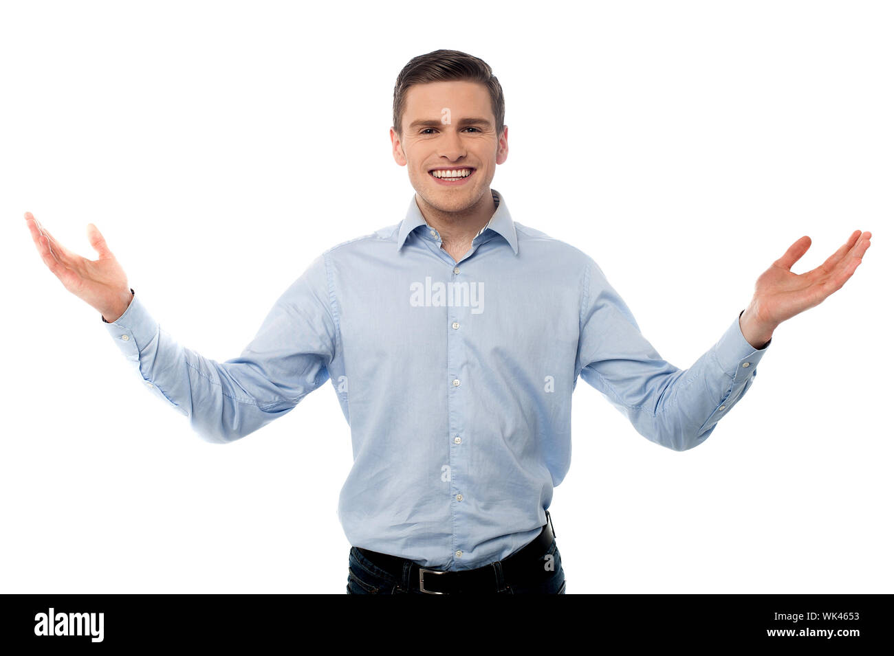 Smiling man standing with open arms, gesture Stock Photo Alamy