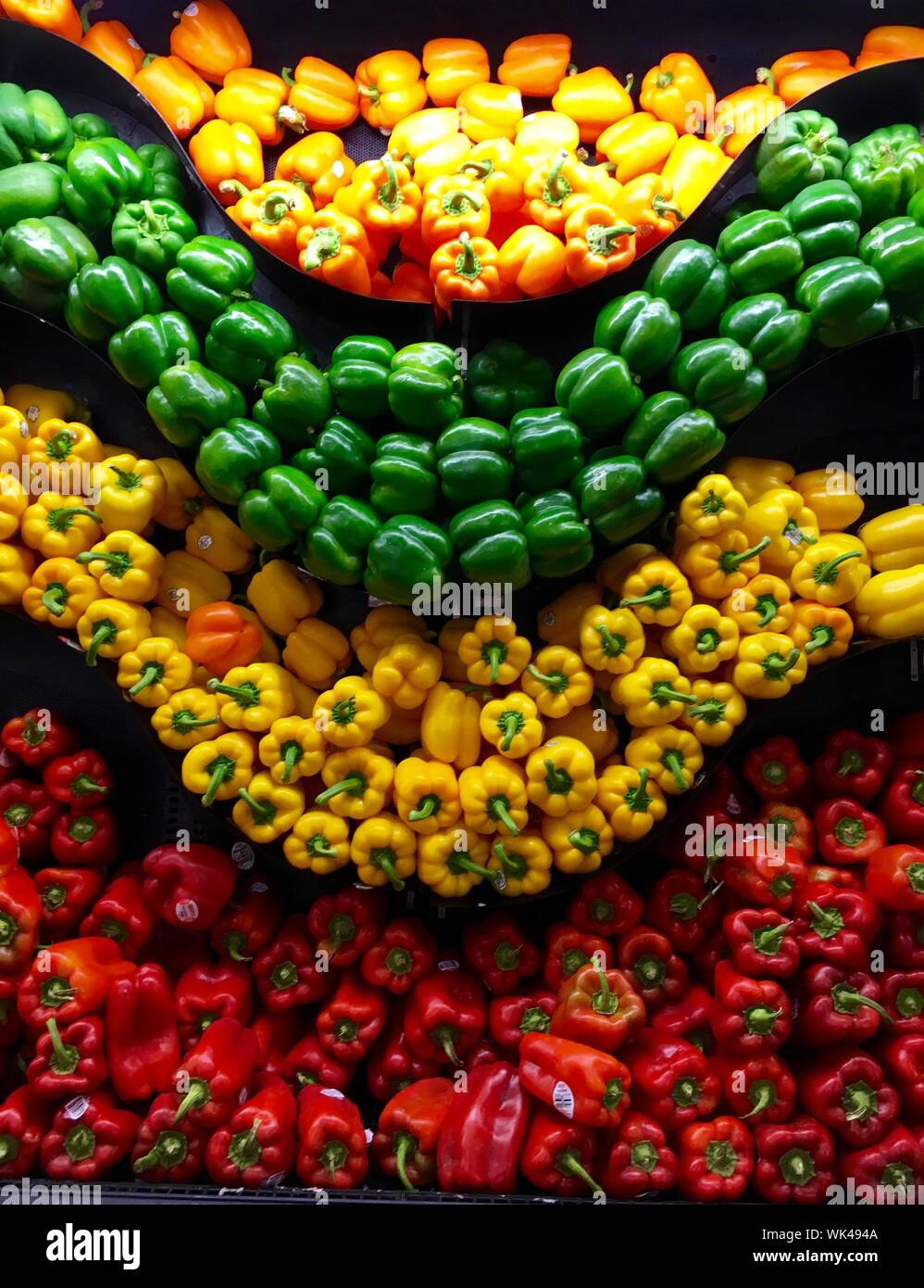 Various Bell Peppers In Shelf Stock Photo Alamy