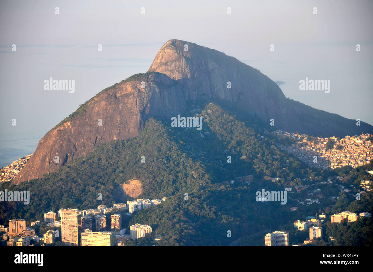 Scenic View Of Houses By Mountain At Morro Dois Irmaos Against Sky Stock Photo