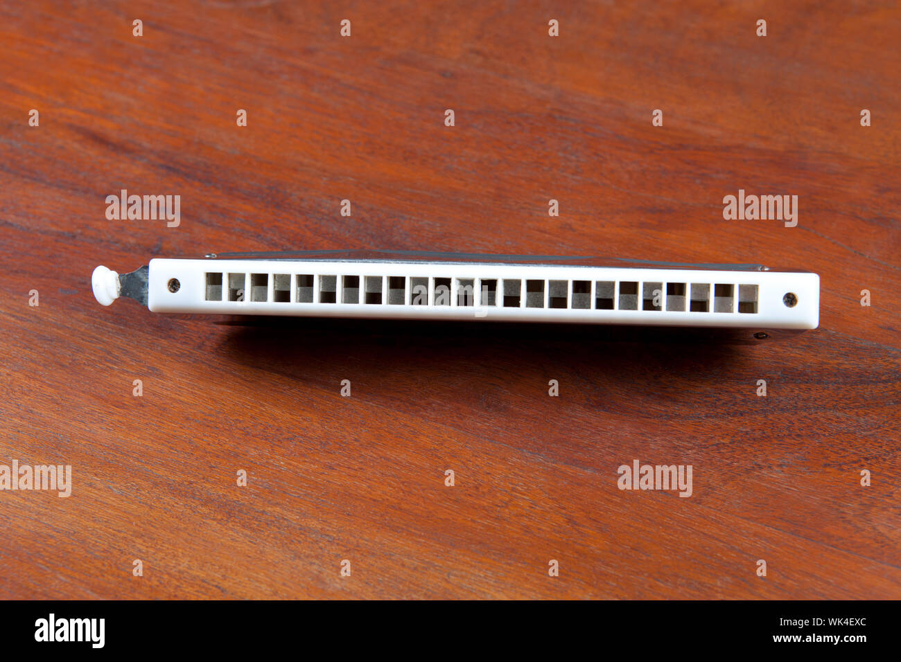 Close-up of a mouth organ on wooden floor Stock Photo