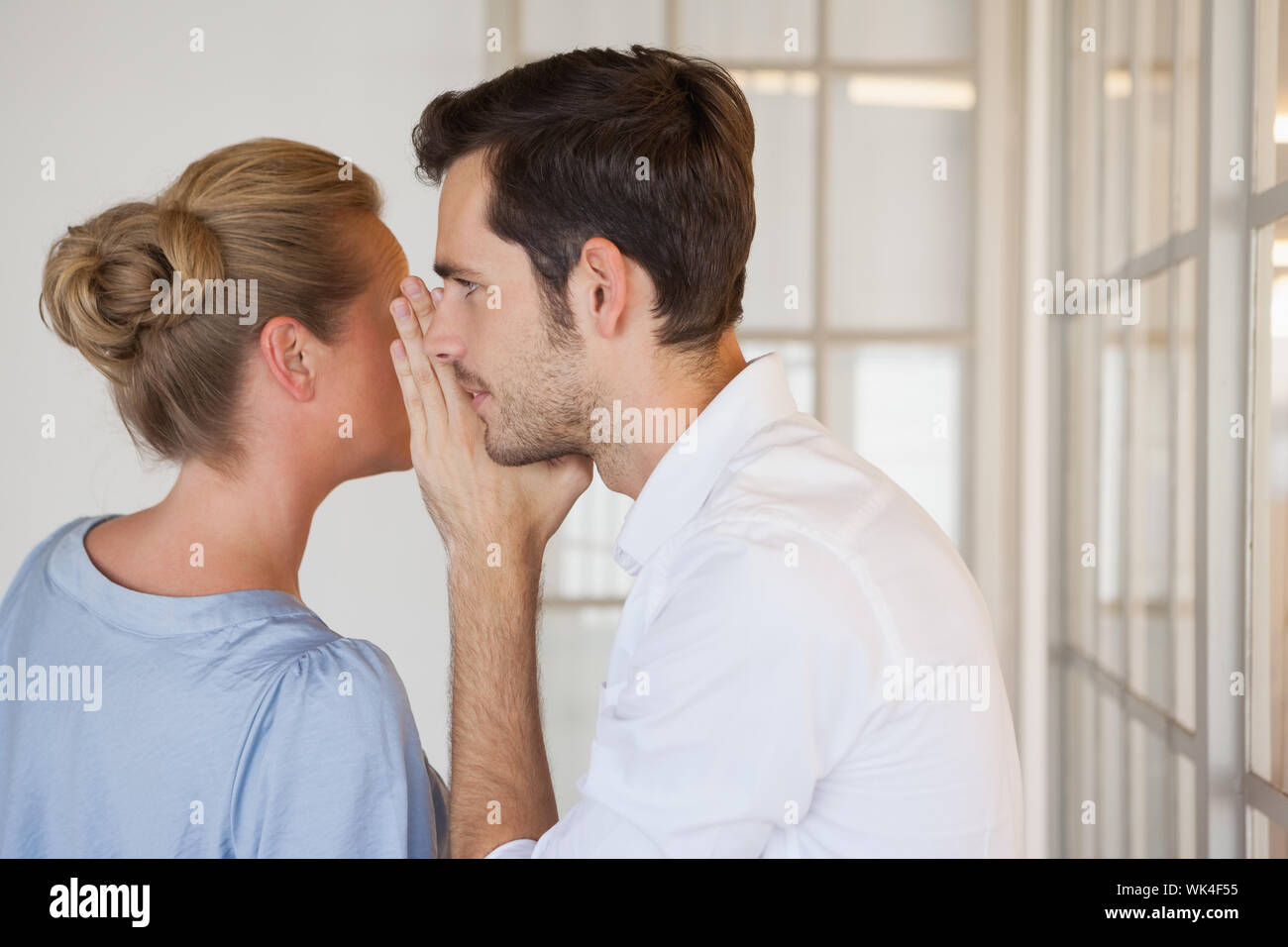 Casual Business People Gossiping Together In The Office Stock Photo Alamy