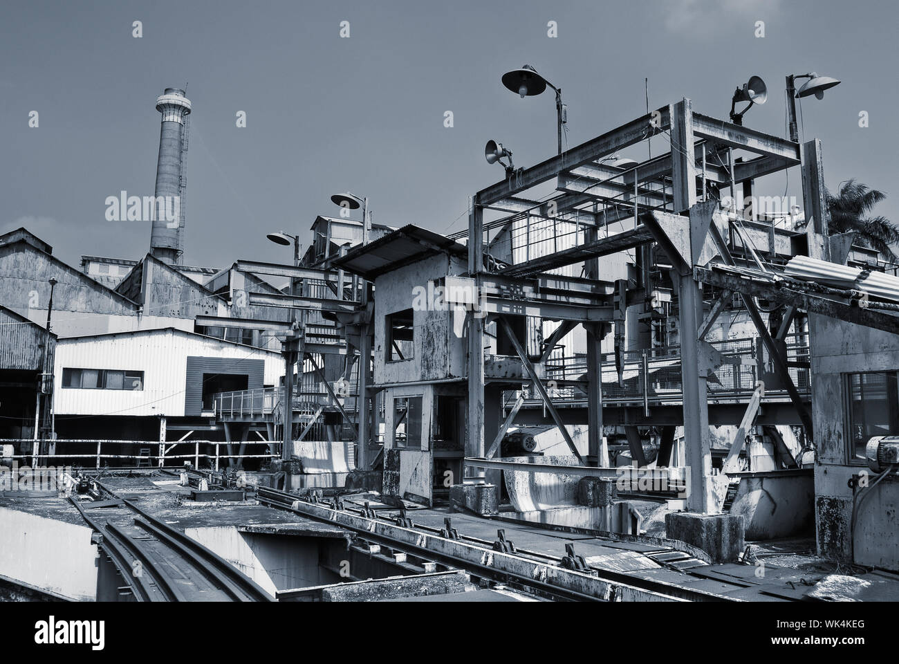 Discard old industrial factory exterior with buildings and smokestack ...