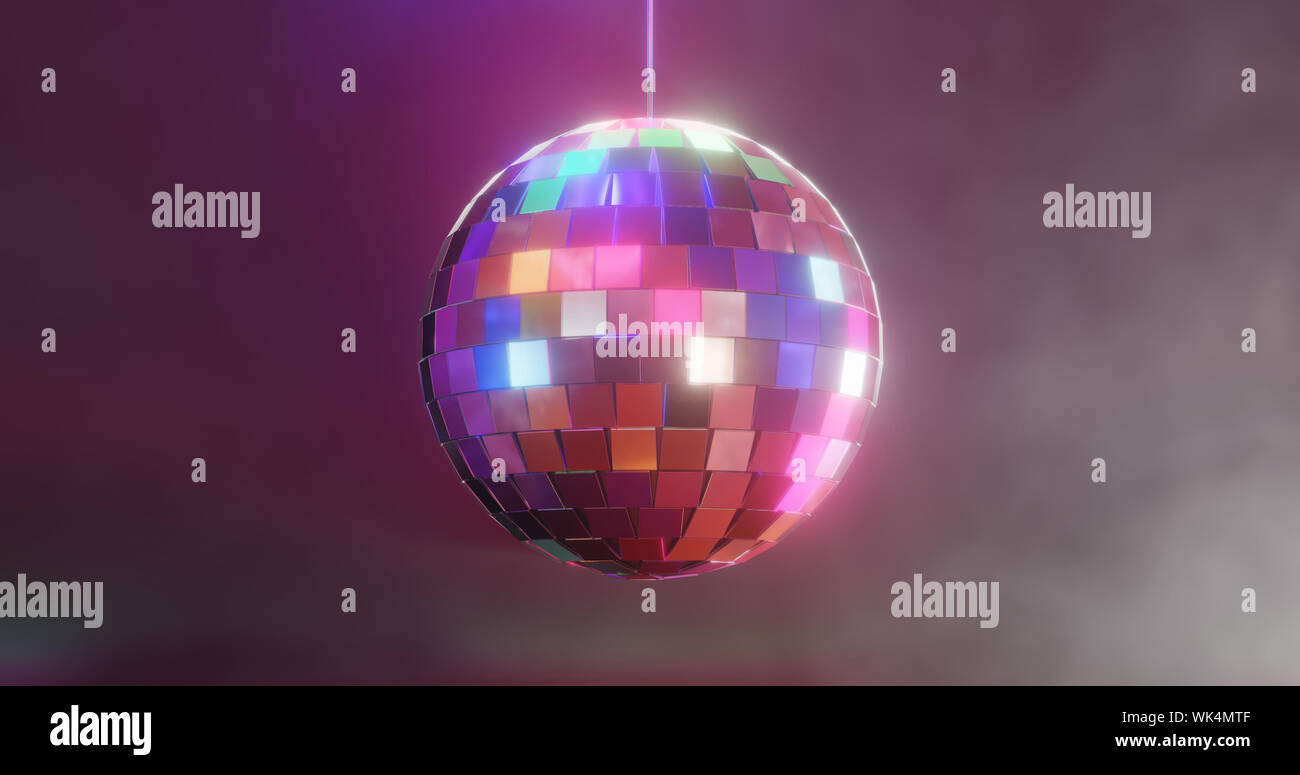 Discoball colorful with glow onn smoky dark background. Have a nice party! Stock Photo
