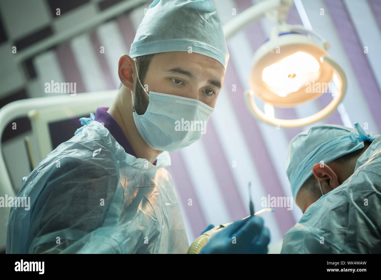 Doctors making dental surgery. Dental clinic manipulation Stock Photo