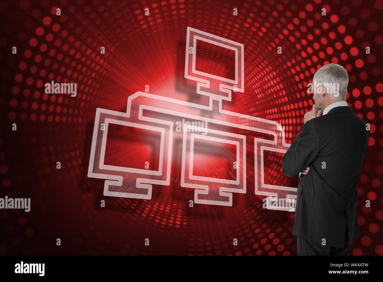 Composite image of computer connection and businessman looking against red pixel spiral Stock