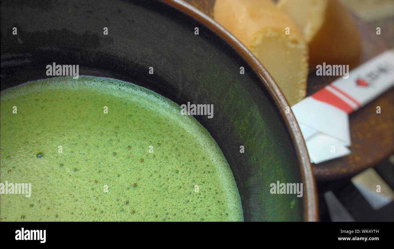 Close-up Of Matcha Tea In Container Stock Photo