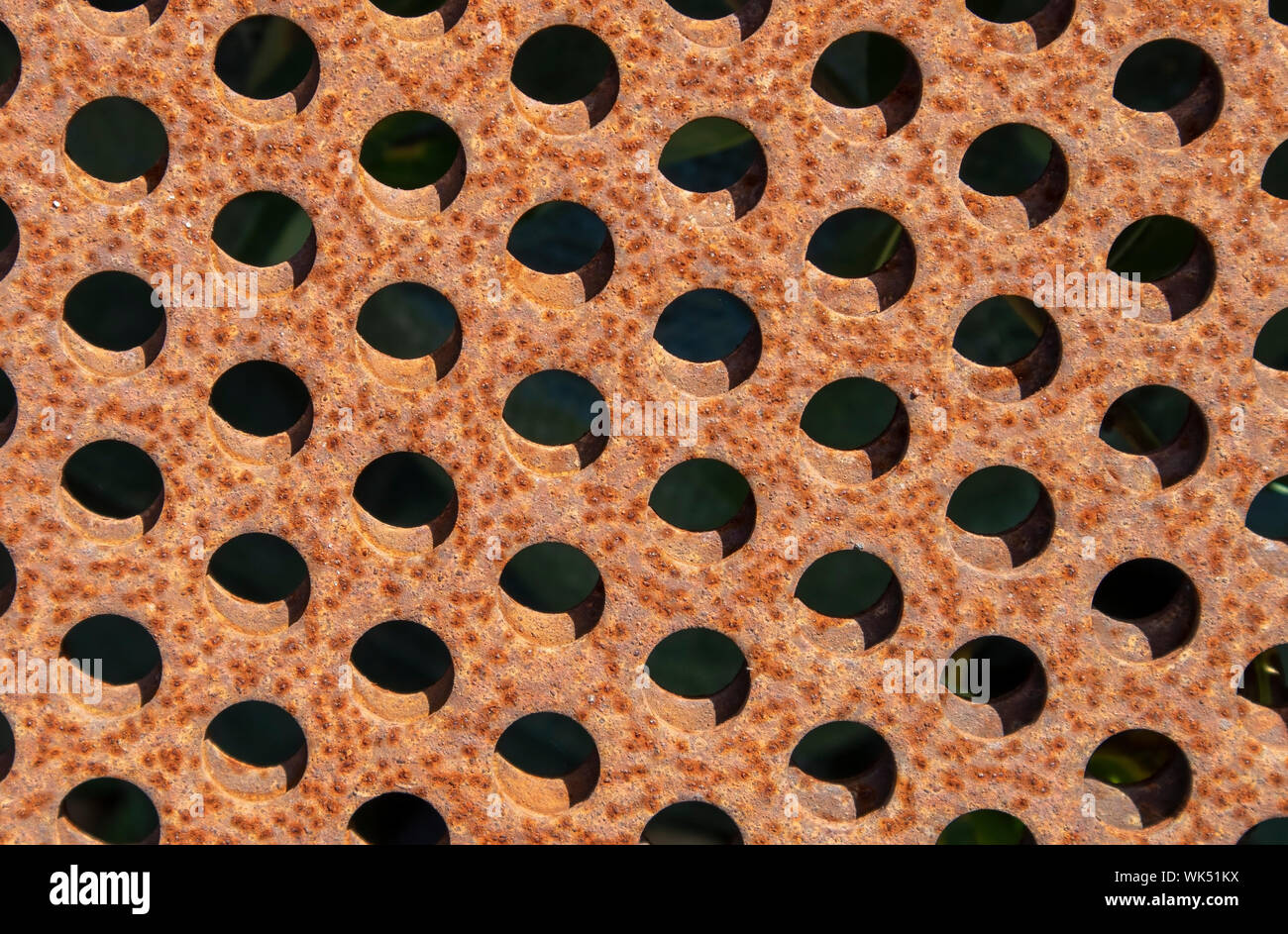 rusty metal plates with holes Stock Photo