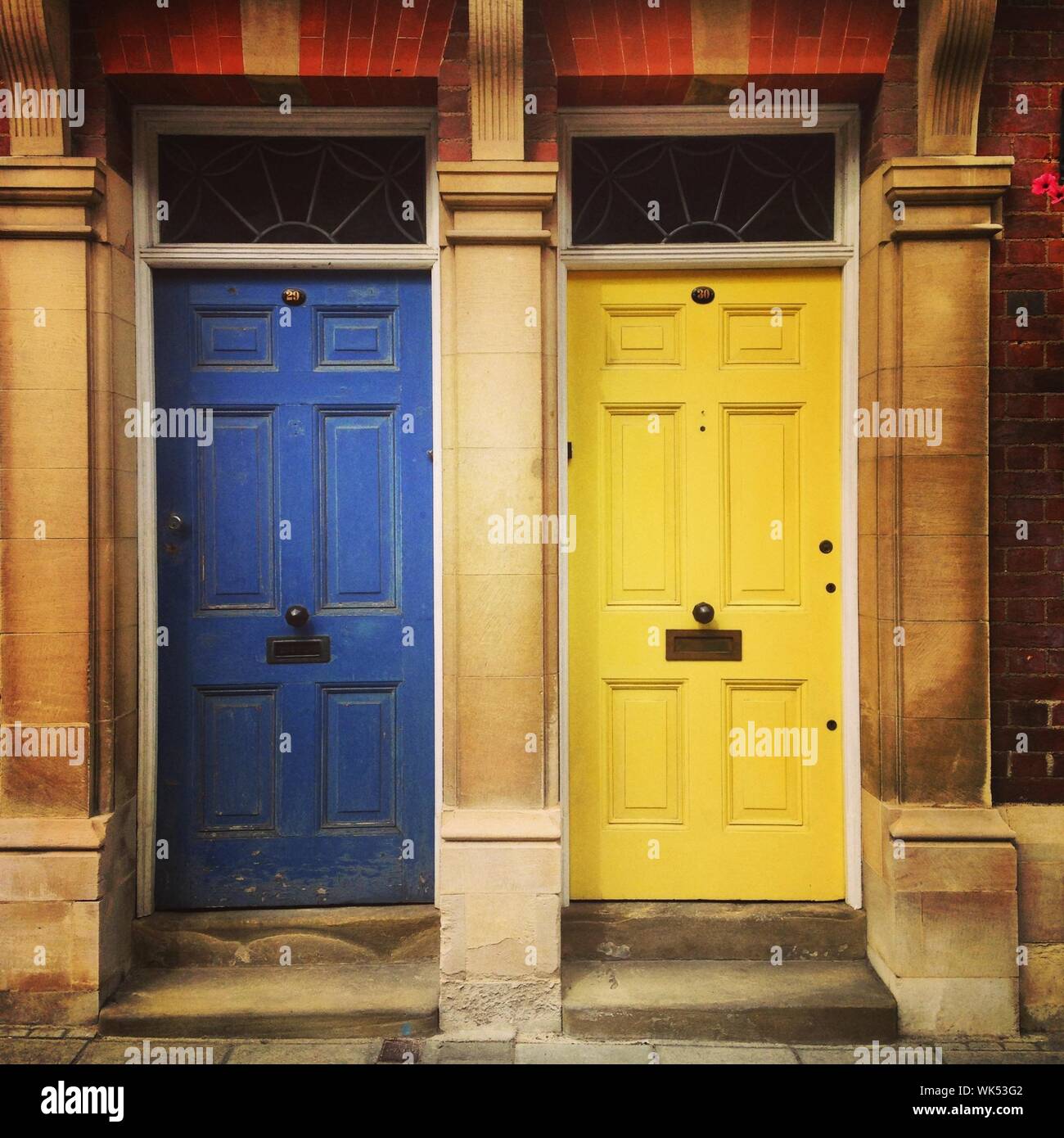 Yellow building blue doors hires stock photography and images Alamy