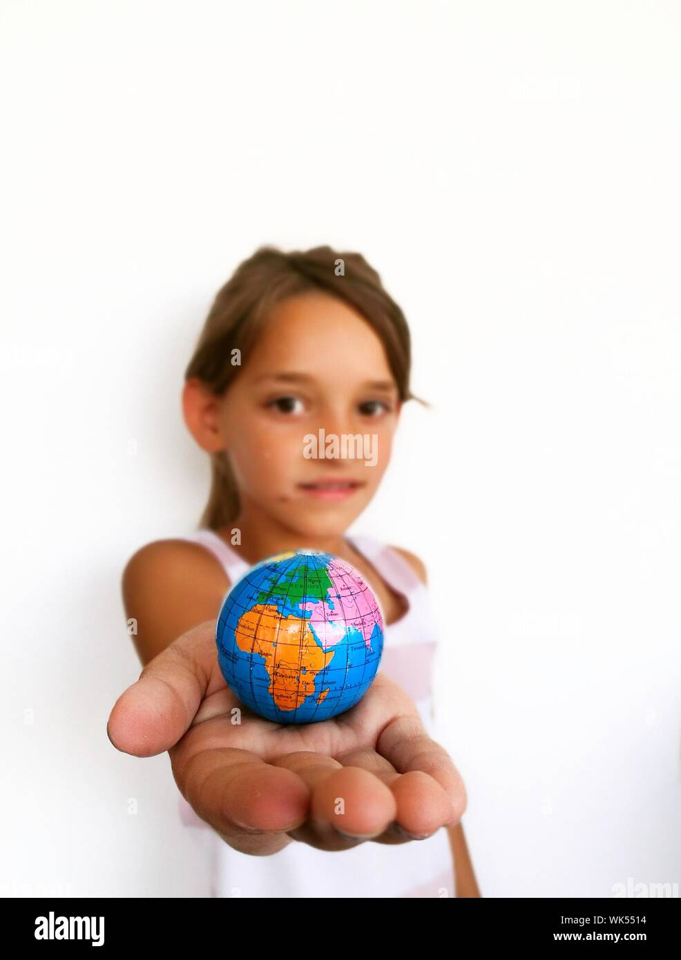 Girl holding globe hi-res stock photography and images - Alamy