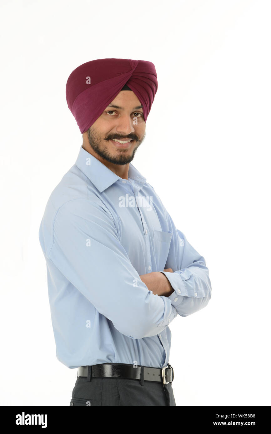 Indian businessman standing with his arms crossed Stock Photo - Alamy