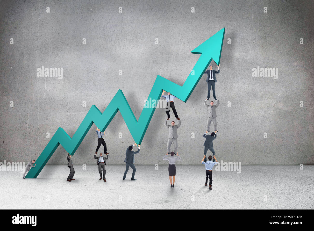 Business team holding up arrow against grey room Stock Photo - Alamy