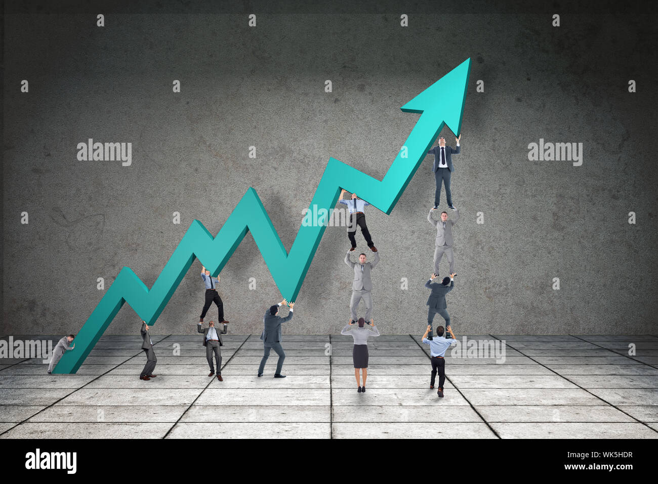 Business team holding up arrow against grey room Stock Photo - Alamy