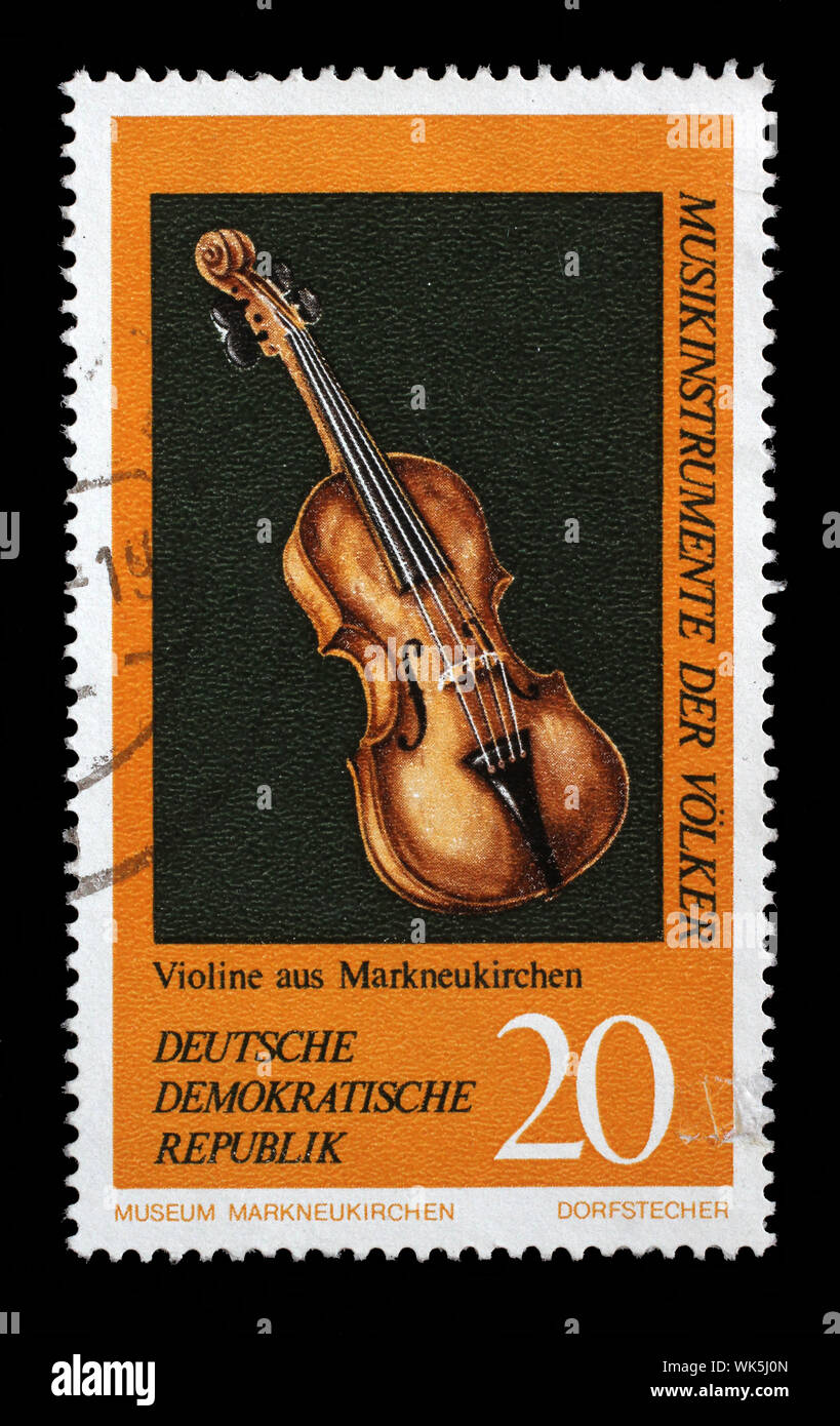 Stamp issued in Germany - Democratic Republic (DDR) shows Violin, Musical Instruments from the Music Museum in Markneukirchen, circa 1971. Stock Photo