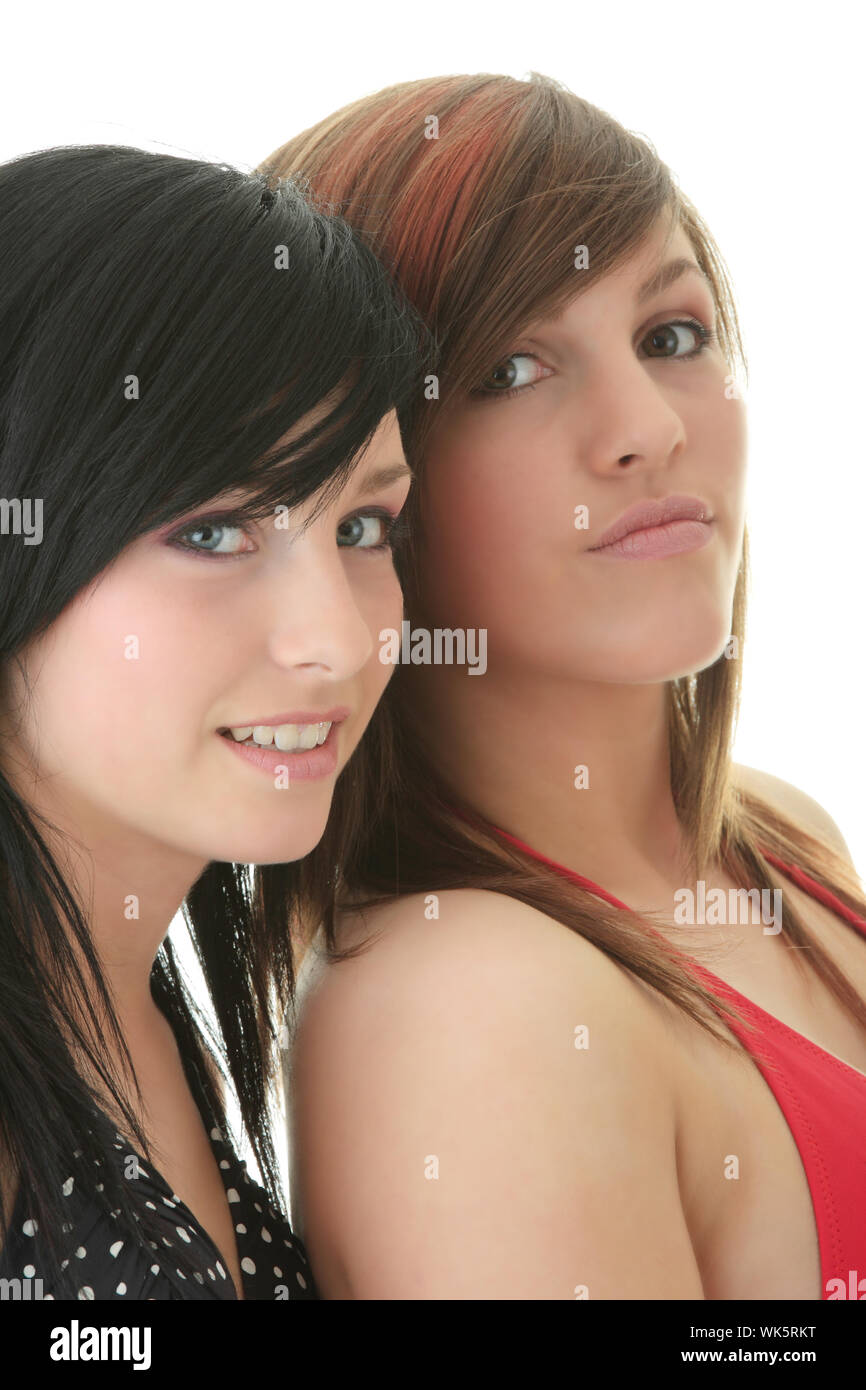 Two teen friends girls (sisters) in bikini swimsuits isolated on white