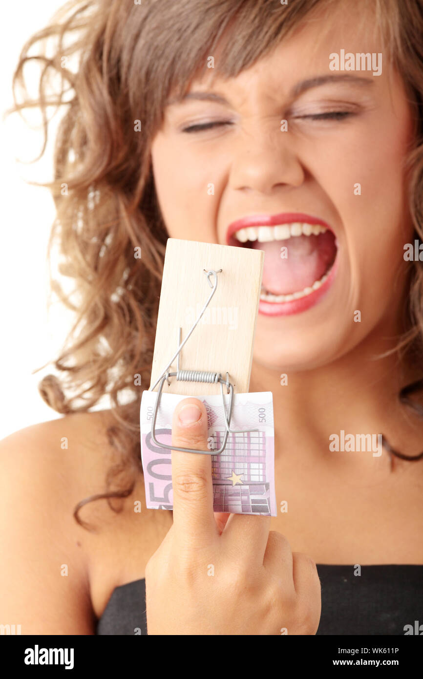 Screaming woman after geting traped by mouse trap with 500 euro Stock Photo