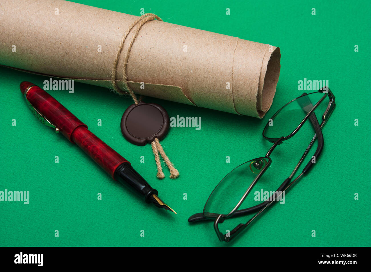 scroll with the seal on a green background Stock Photo - Alamy