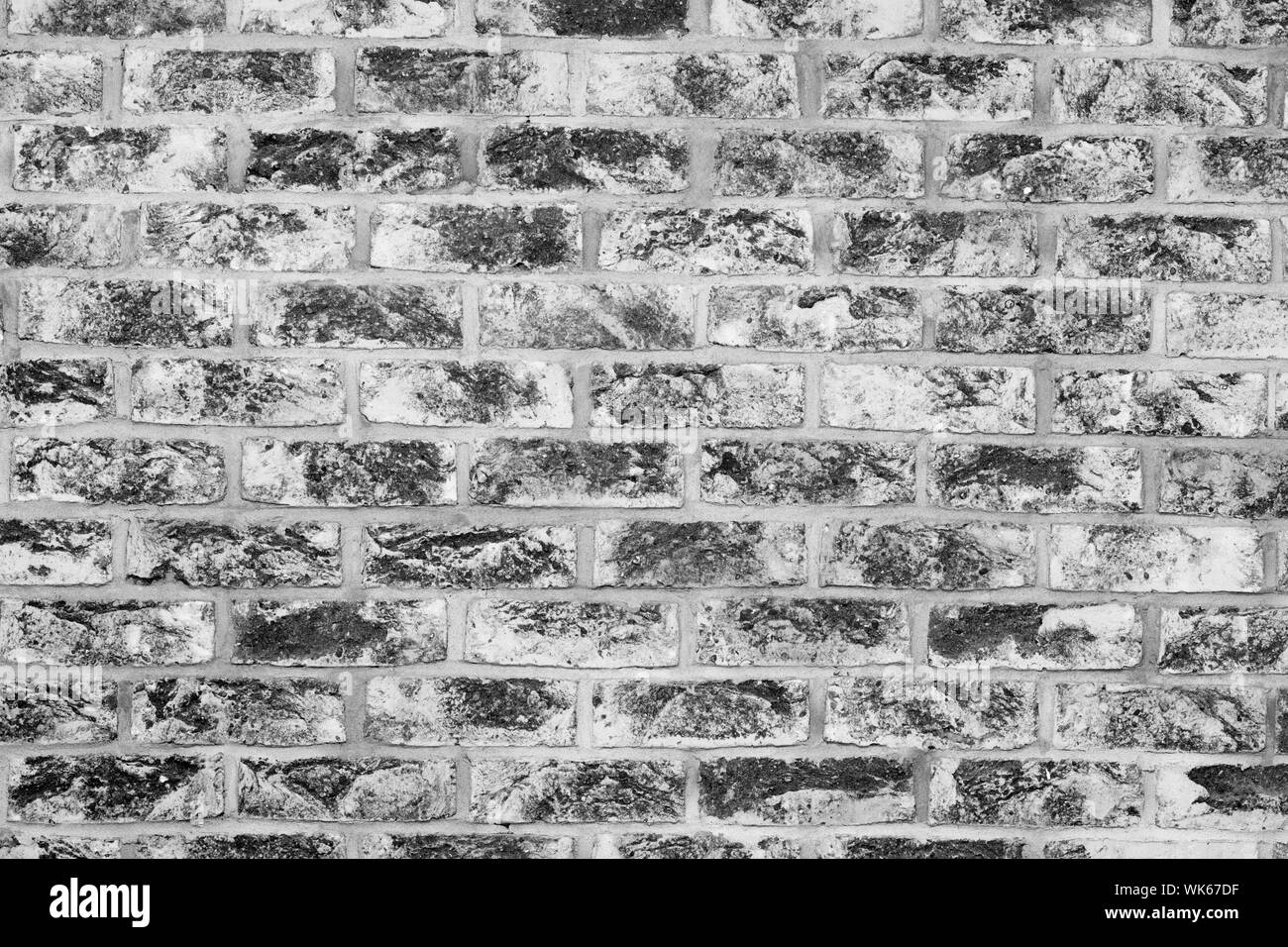 Old grunge brick wall background in black and white Stock Photo - Alamy