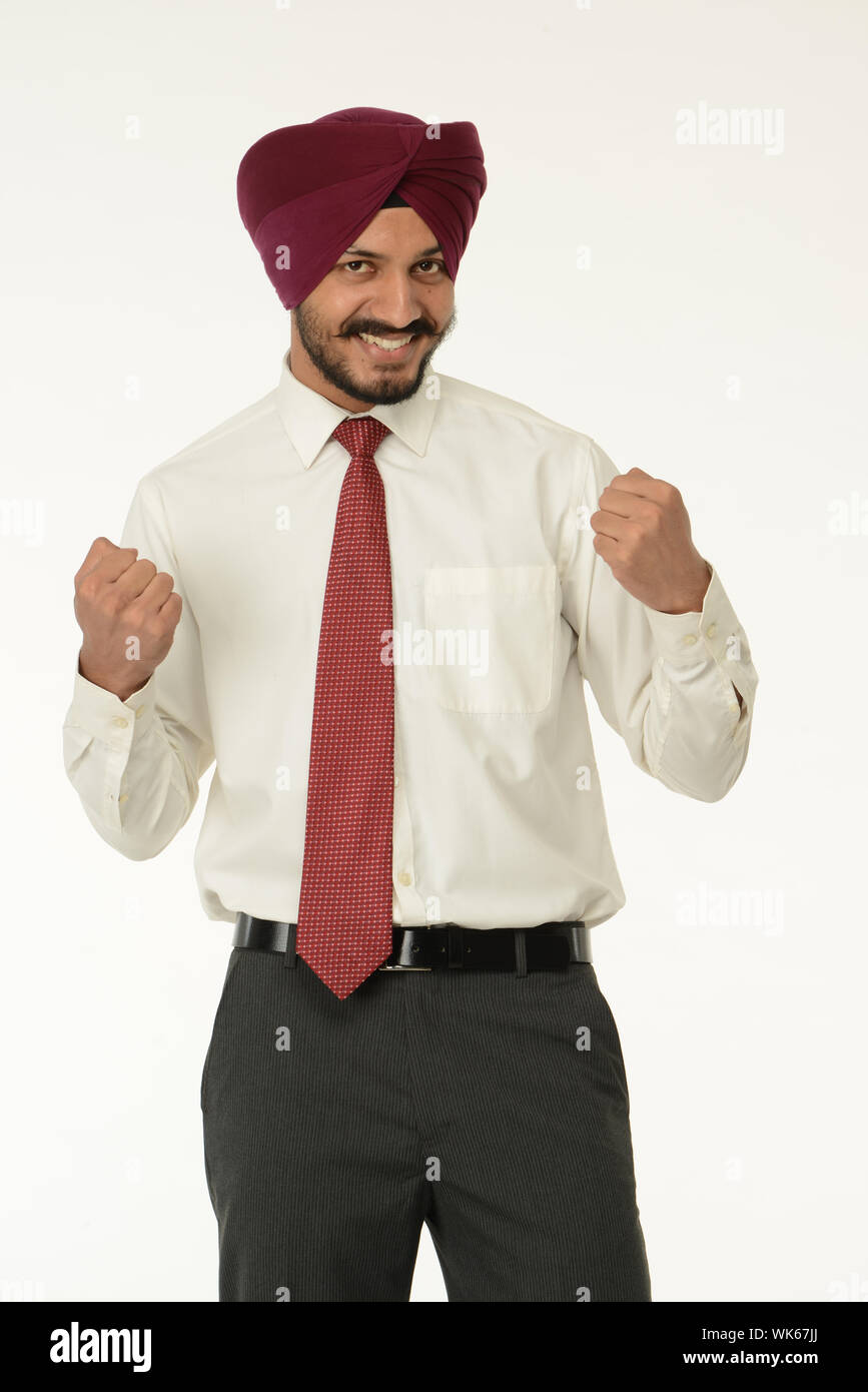 Businessman celebrating his success and smiling Stock Photo - Alamy
