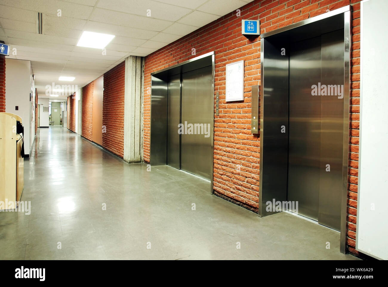 Freight And Regular Steel Door Elevators With Signs In An Empty