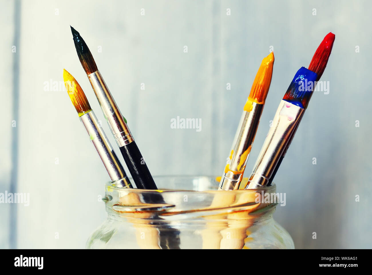 Photo of paint brushes in a jar Stock Photo Alamy