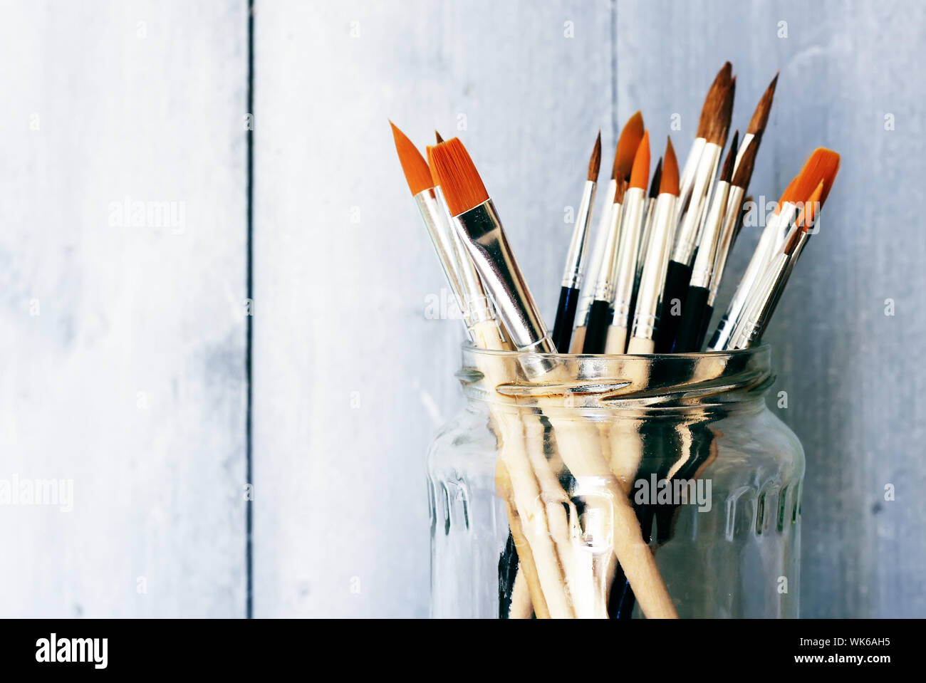 Photo of paint brushes in a jar Stock Photo Alamy