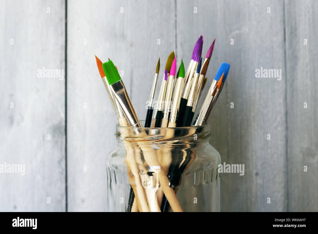 Photo of paint brushes in a jar Stock Photo Alamy