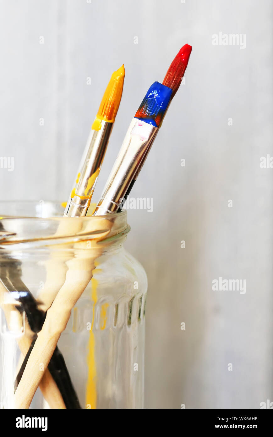 Photo of paint brushes in a jar Stock Photo Alamy