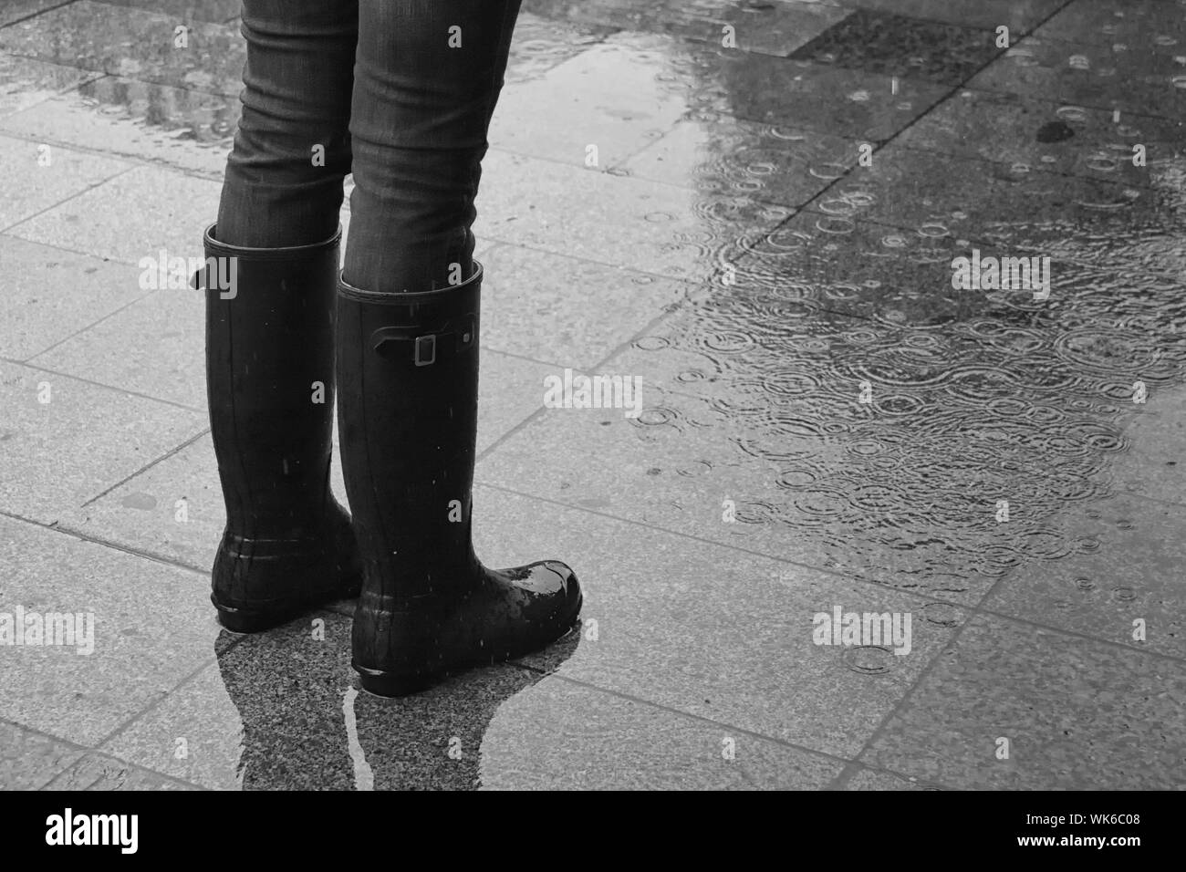 Wet rain boots wearing hires stock photography and images Alamy