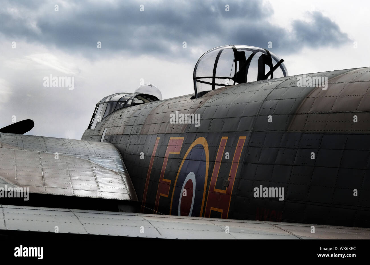 Lancaster bomber under restoration at East Kirkby, Lincolnshire. Displayed as museum piece with working Merlin engines. Stock Photo