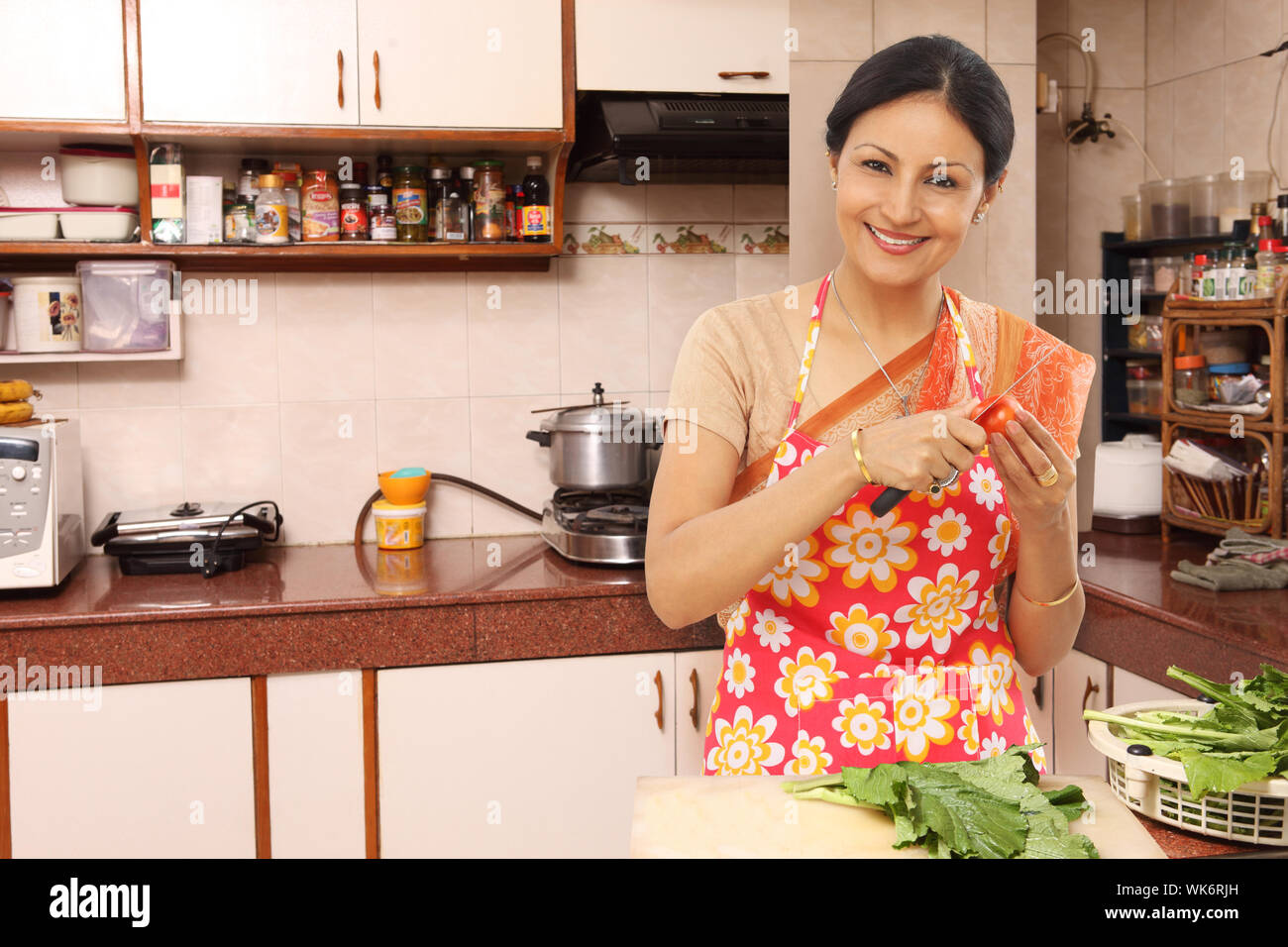 Mature woman cooking kitchen hi-res stock photography and images - Alamy