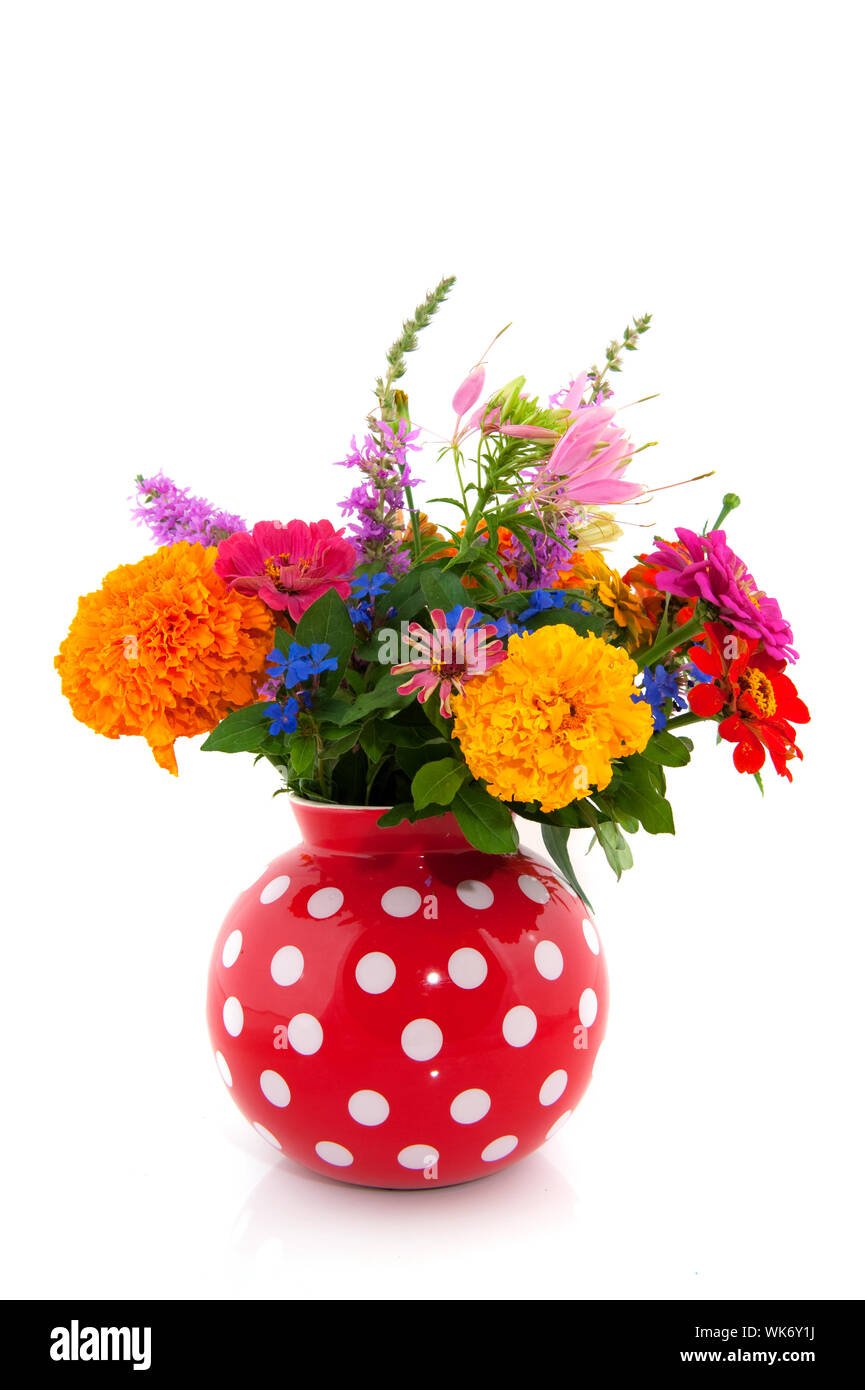 Cheerful summer bouquet flowers in speckles vase Stock Photo