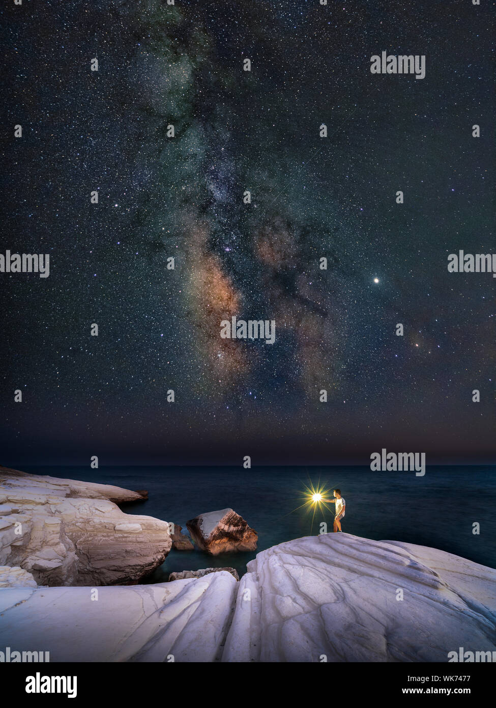 Milky way rising above White Stones beach in Limassol, Cyprus Stock