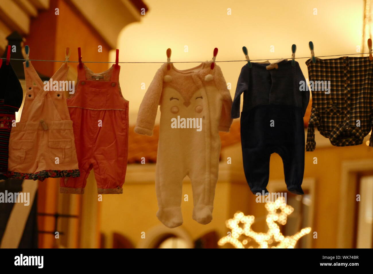 Baby Clothes Drying On Clothesline Stock Photo Alamy