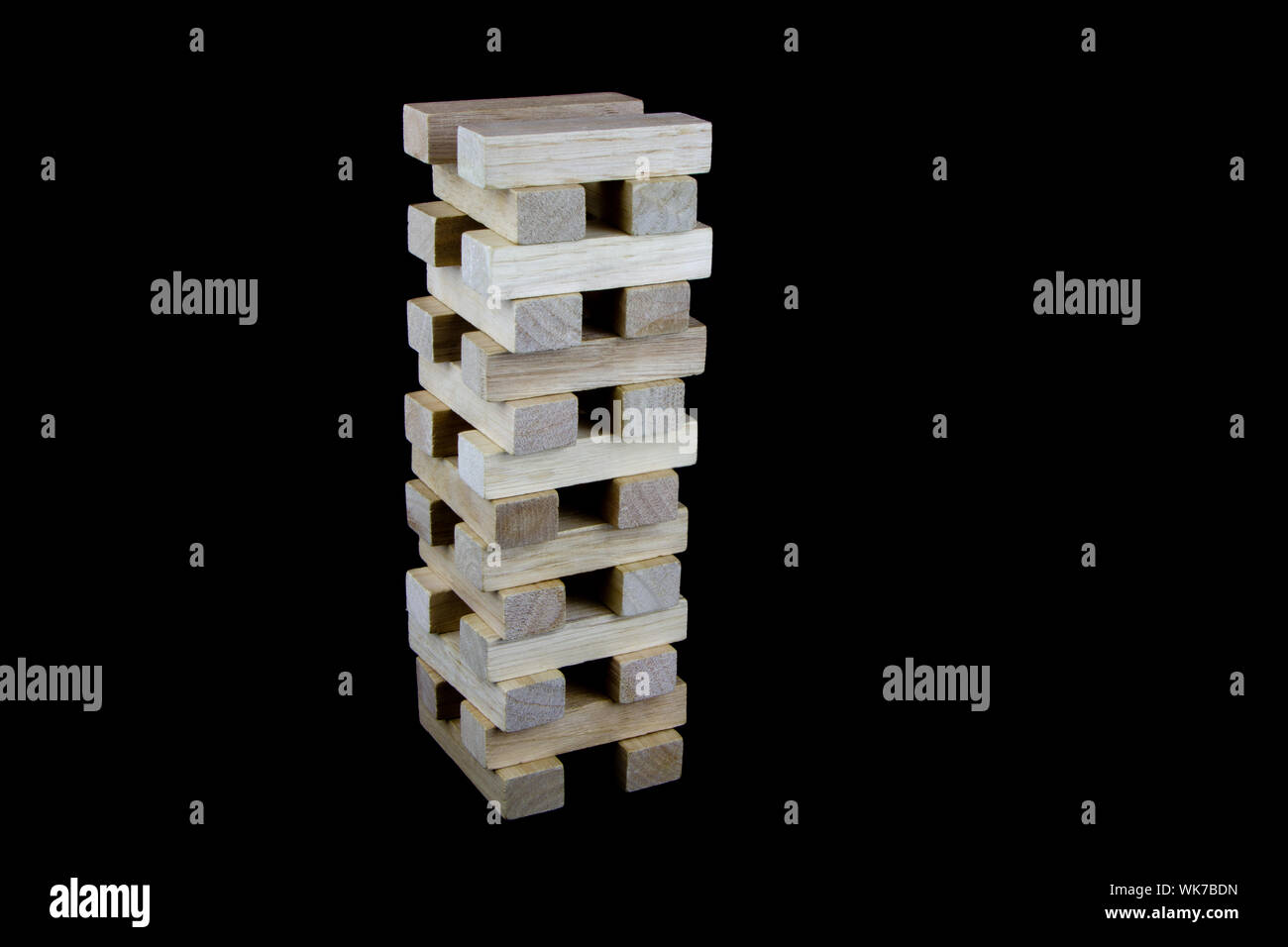 Stack of wooden play blocks isolated against a black background Stock ...