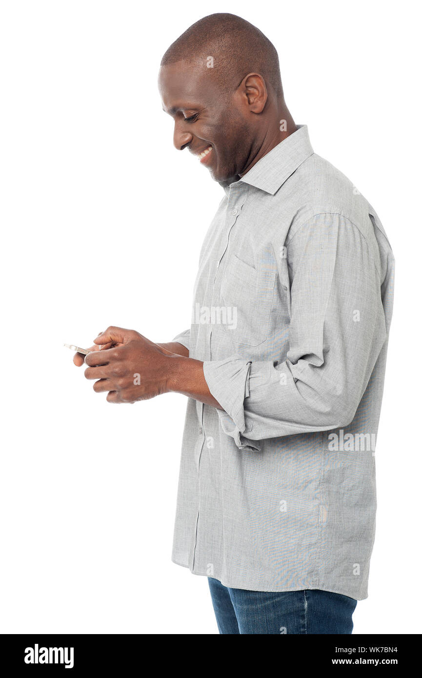 Middle aged causal man using his cell phone Stock Photo