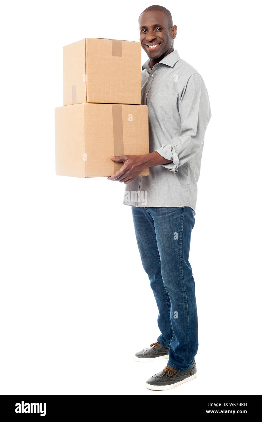 Handsome male with with stack of boxes isolated on white Stock Photo