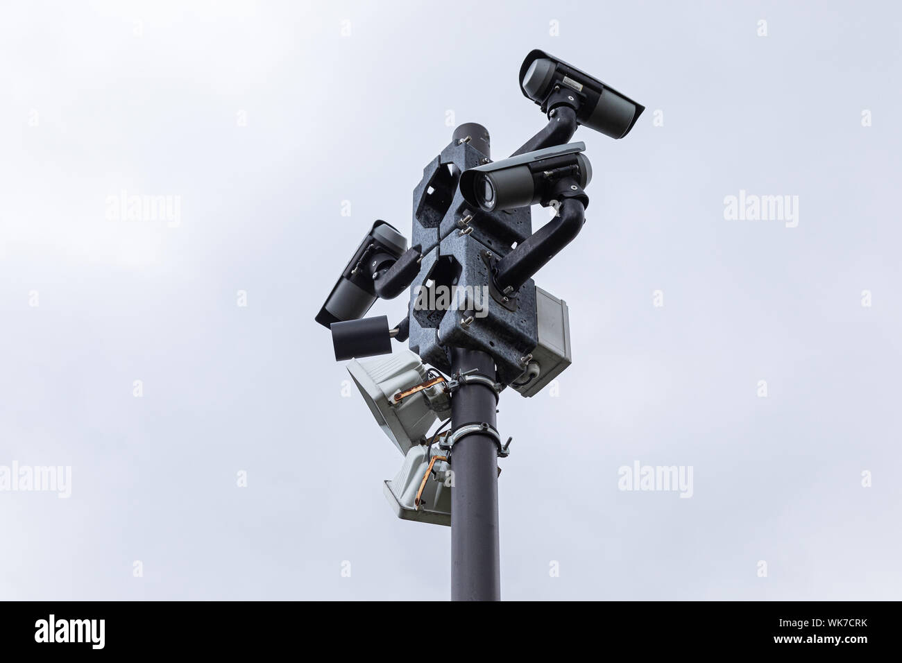 Black Video Monitoring Cameras And Street Lamps On Column Against Clear Sky Stock Photo Alamy