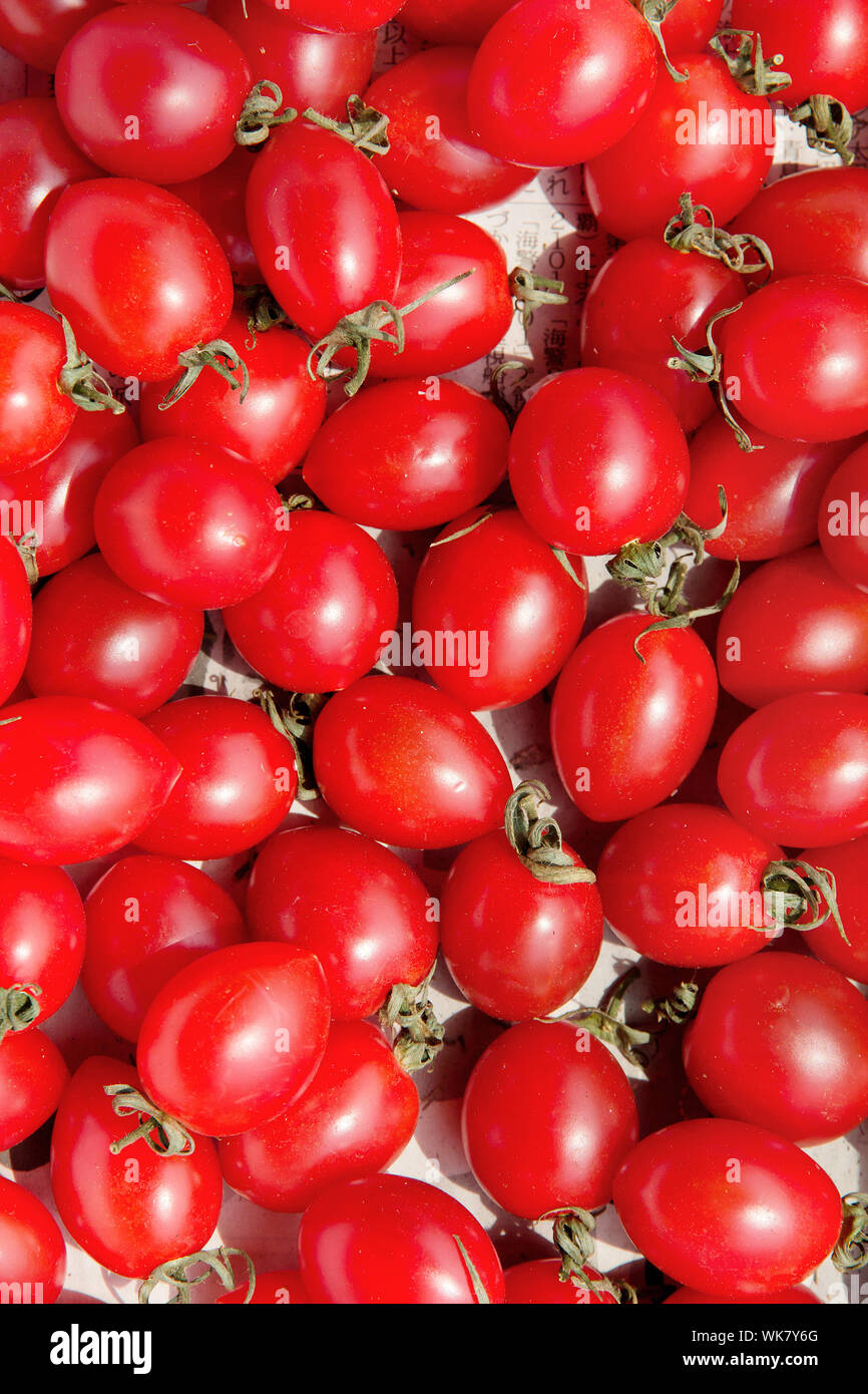 red tomatoes background Stock Photo