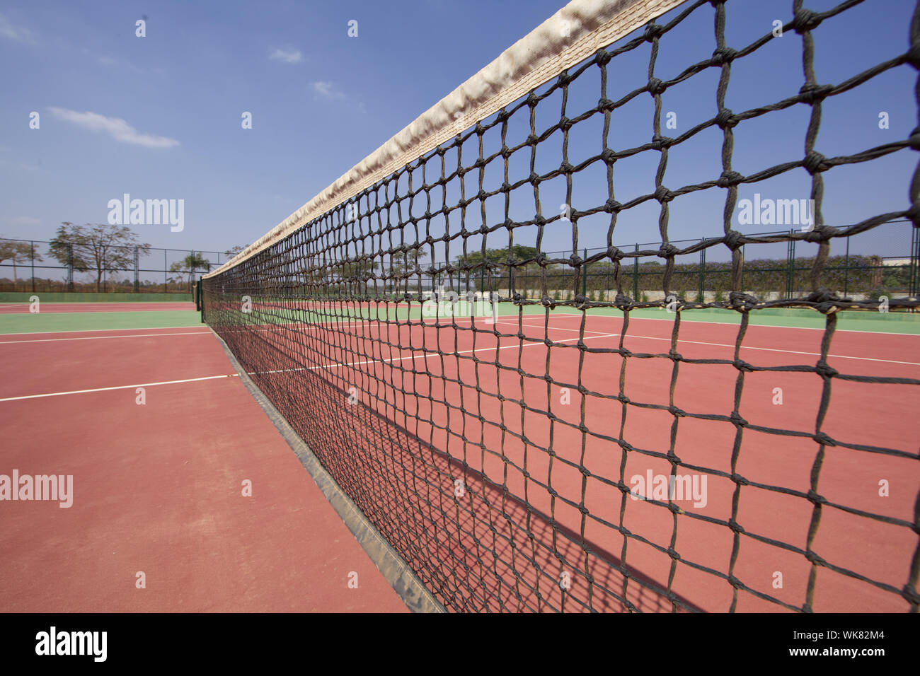 Tennis net in a tennis court Stock Photo