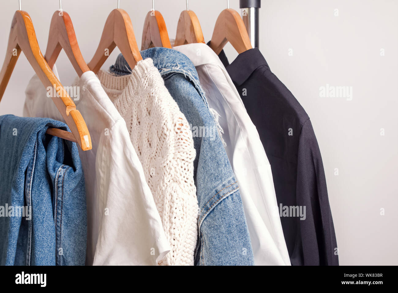 Woman minimalist wardrobe in white and denim Stock Photo