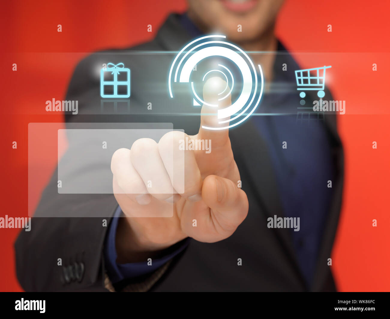 handsome man in suit pressing virtual button Stock Photo