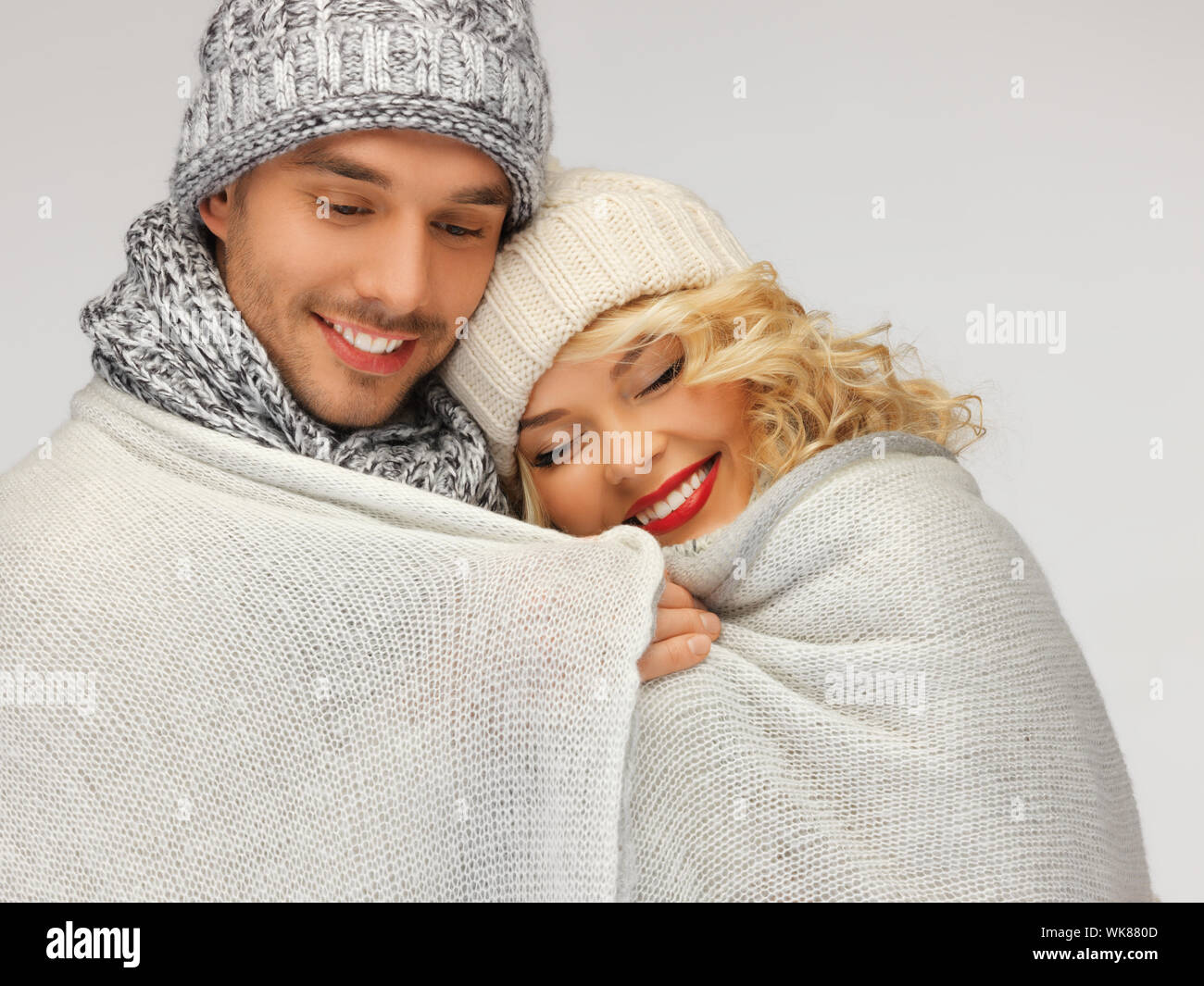 family couple under warm blanket Stock Photo Alamy